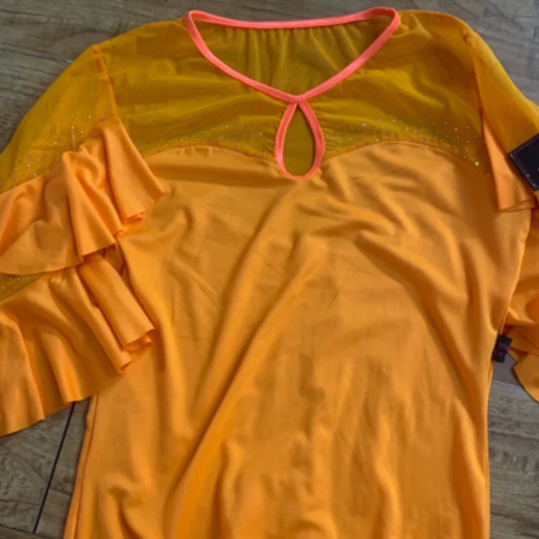 恒世舞服橘色菲边袖连体上衣