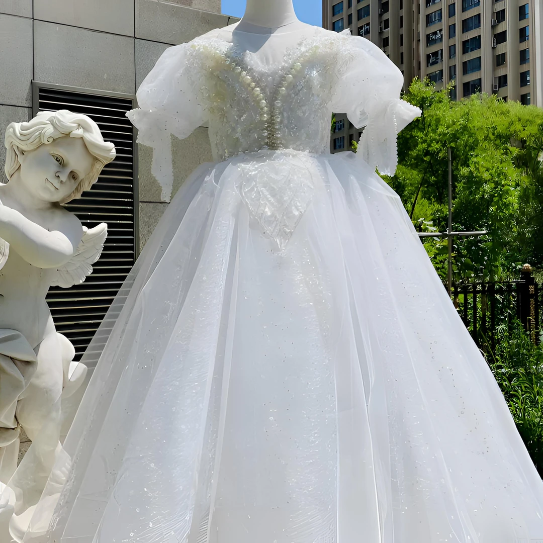 白色儿童礼裙袖口蝴蝶结银丝网纱炫彩亮片高定版气质女童走秀宴会