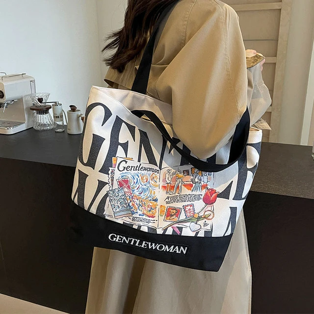 泰国小众字母帆布包包女2024新款上课单肩托特包大容量通勤手提袋
