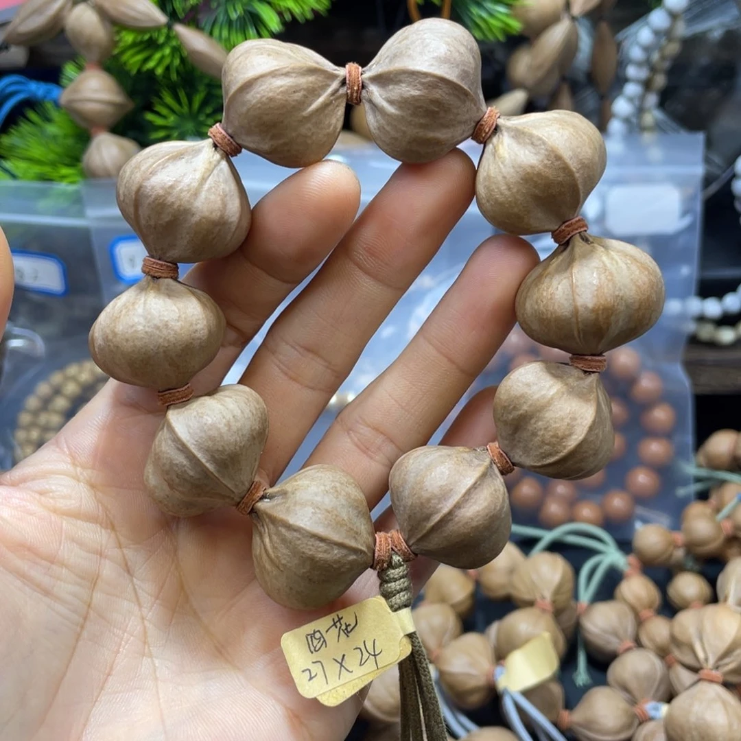 西***雪橄榄核吊坠2724四花铁核