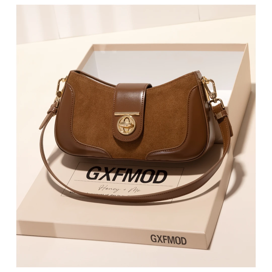 GXFMOD新款高级感通勤法棍包女2025秋冬复古牛皮包百搭单肩斜挎包