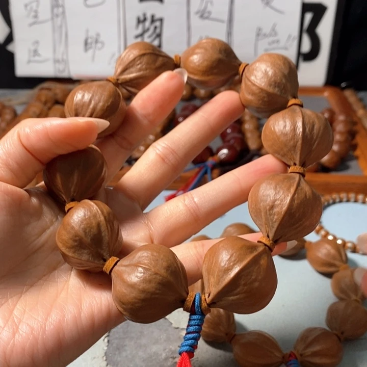 牛***手串橄榄核0372精品4花老树王蒜头铁核8+2颗
