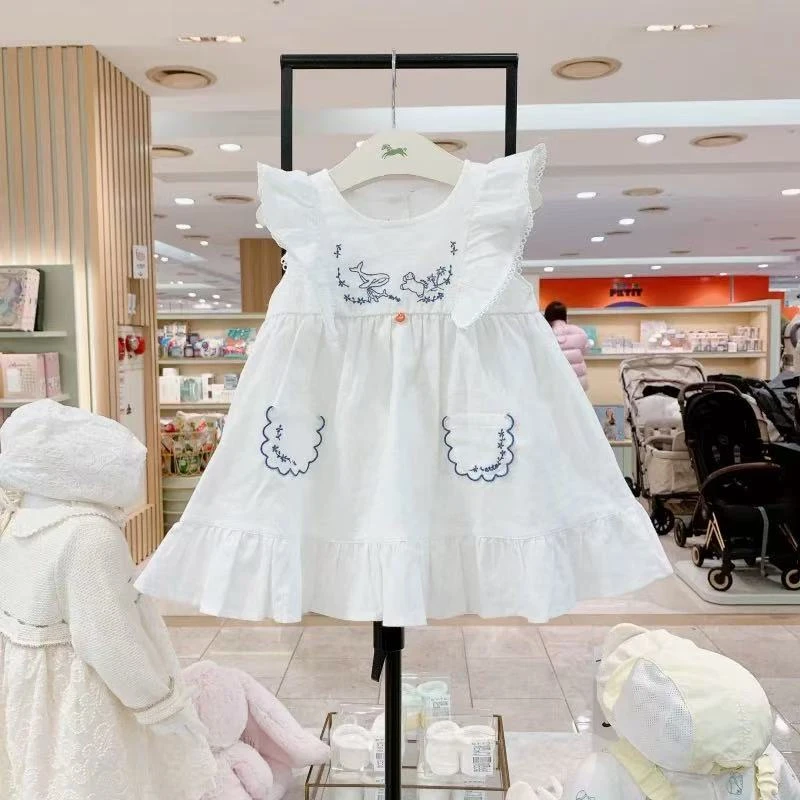 出口韩单 飞马25夏季新款女童宝宝棉麻白色刺绣贴兜飞飞袖连衣裙