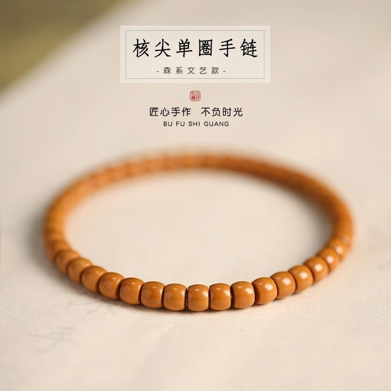 新款正宗森系国潮田园风气质小众精品籽核尖直切桶珠手串单圈素橄