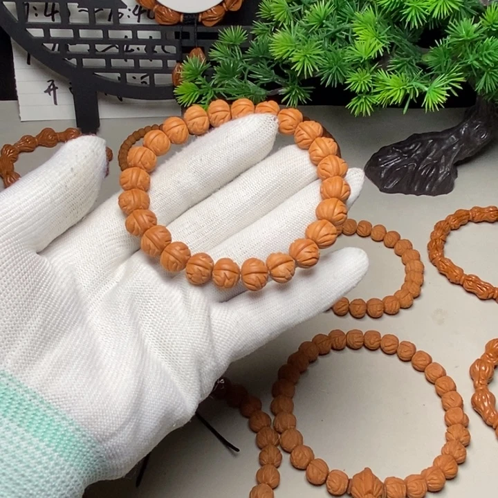 手串桃核凤羽聚宝盆