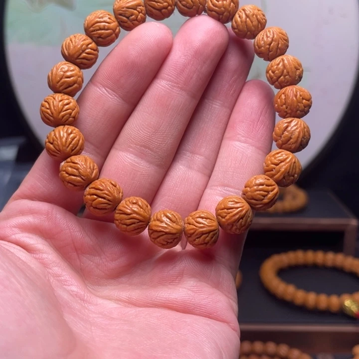 称***雪桃核手串11暴龙火焰