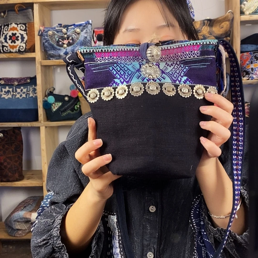 麻***叔织绣土布织锦包包