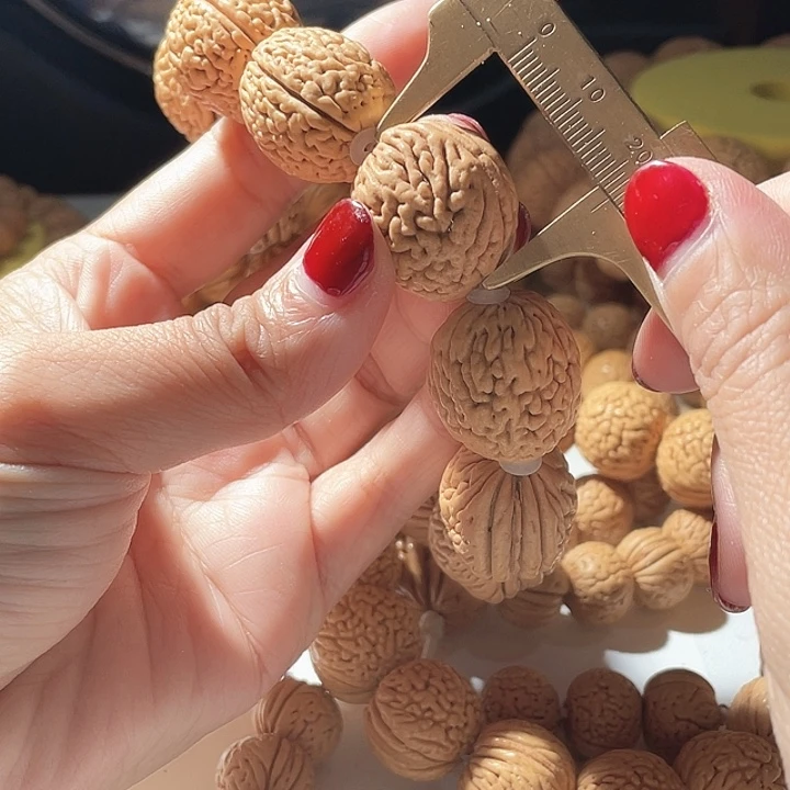 像***人桃核吊坠桃核手串钱袋子79