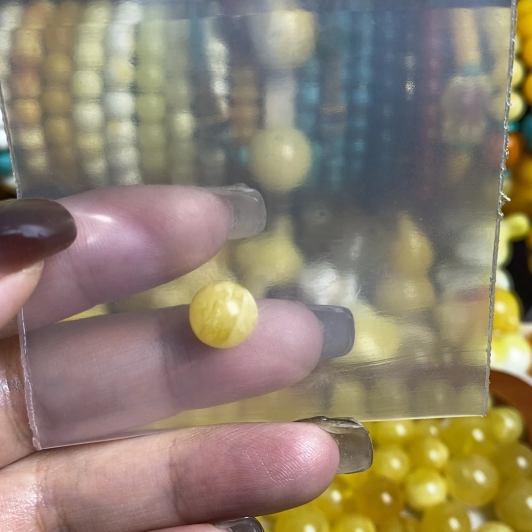 沈***团琥珀未镶嵌裸石圆珠9mm+