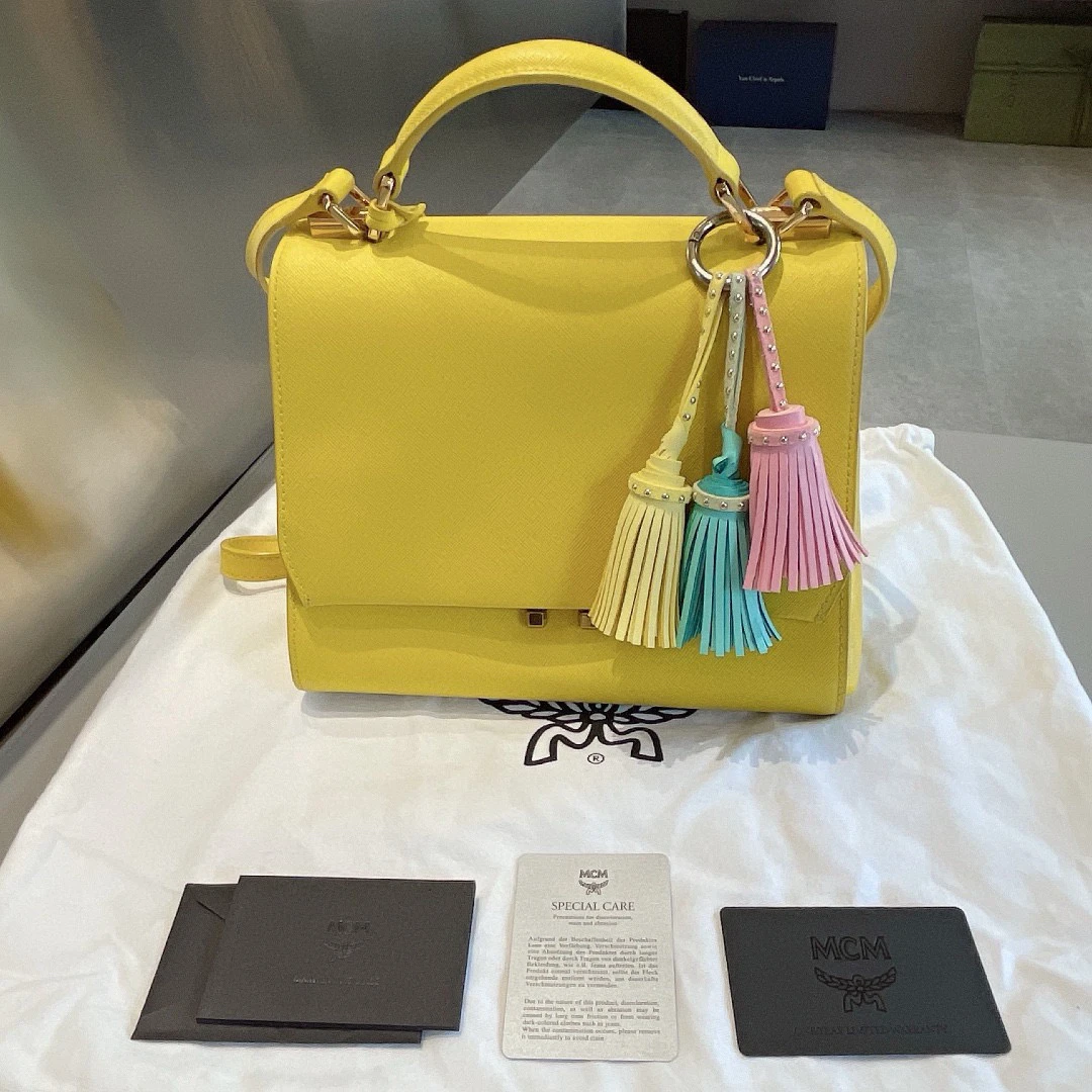 95新 MCM 黄色流苏邮差包手拎包