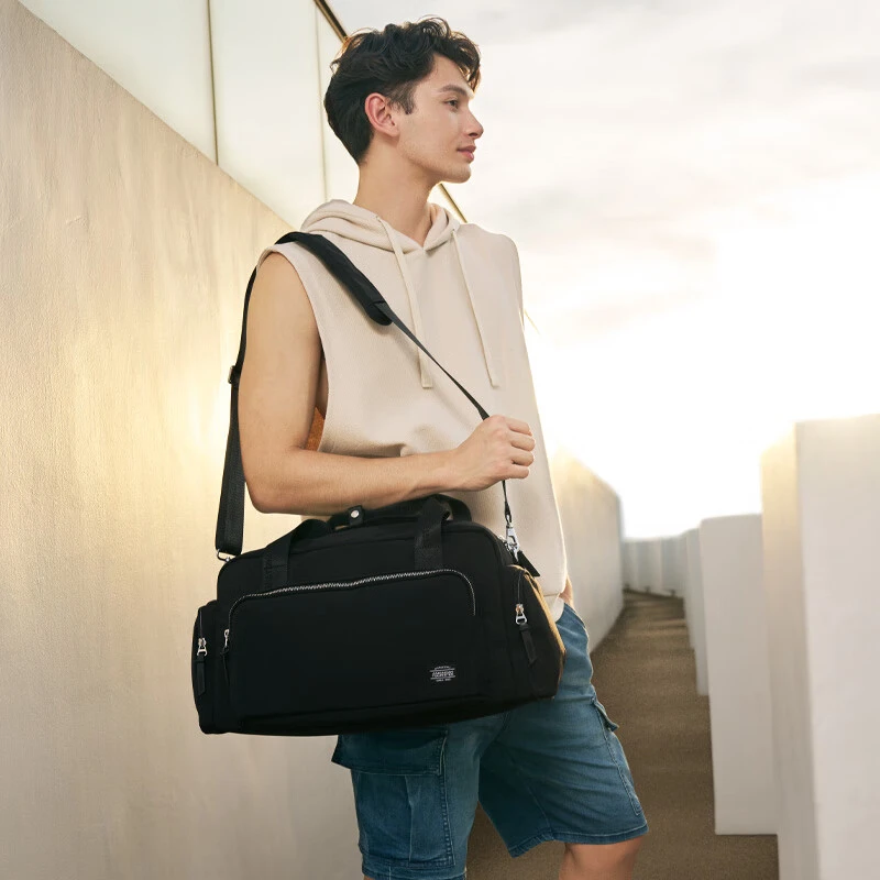 美旅箱包多功能时尚休闲旅行包黑色大容量男士通勤行李袋背包NM2