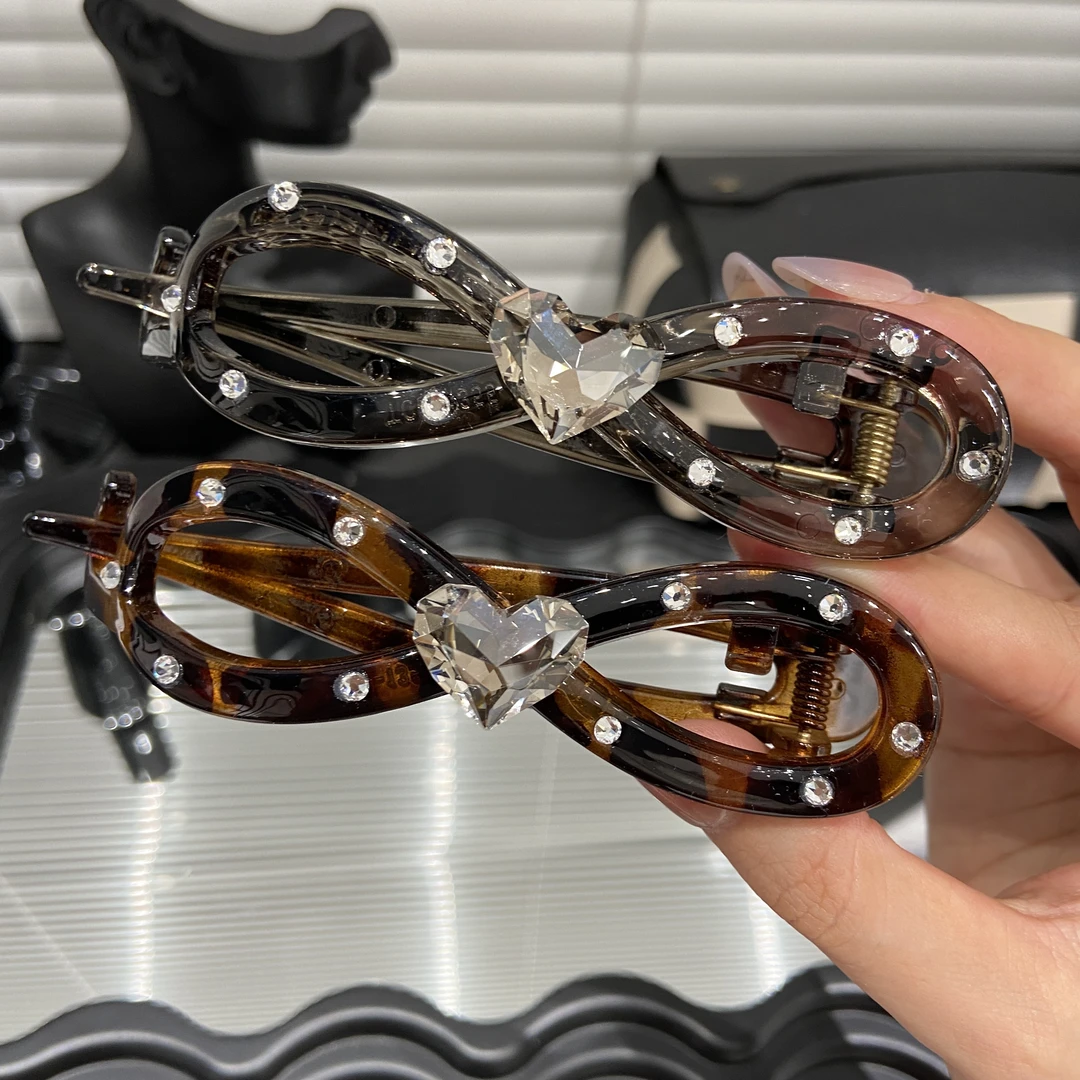 E4599高级感爱心钻8字蝴蝶结扭扭夹后脑勺发夹女镂空盘发半扎发夹