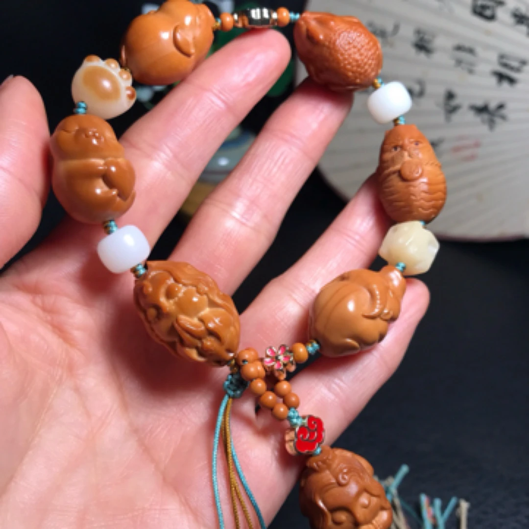 橄榄核雕刻招财小动物多宝手串小猪金蟾牛虎美人鱼九尾狐宝贝兔女