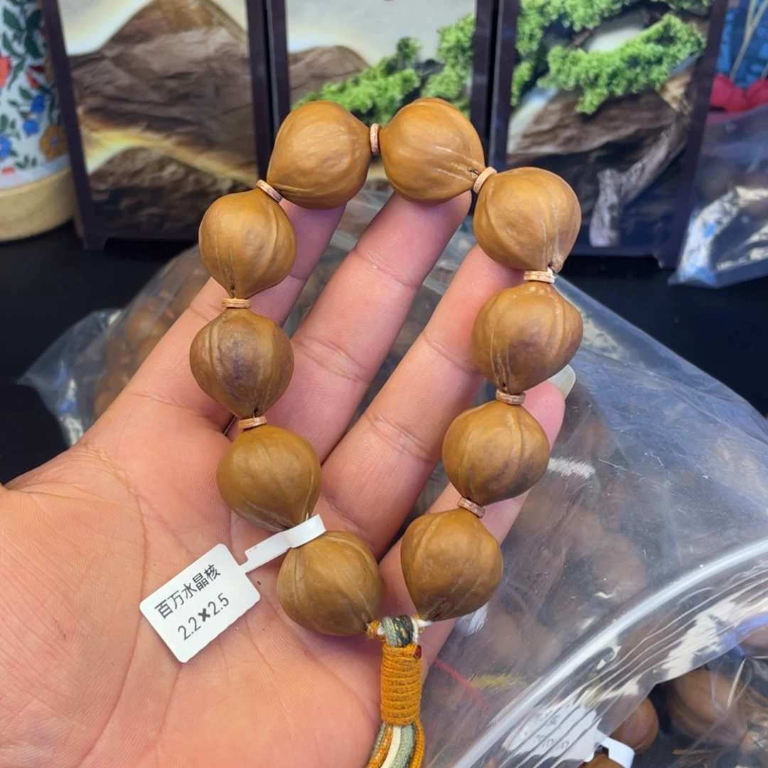 芸***多橄榄核手串百万水晶核22x25