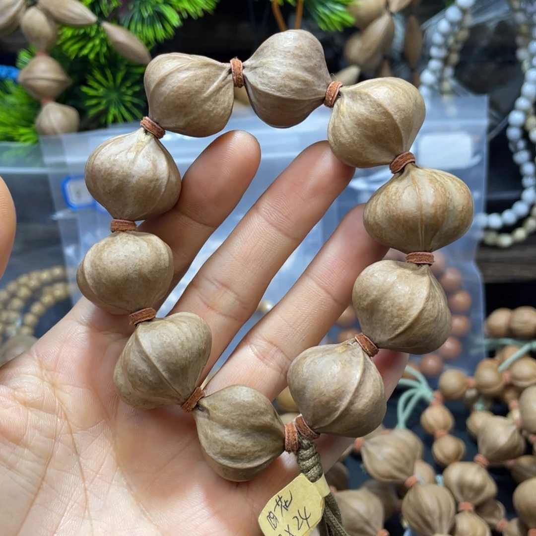 顺***水橄榄核吊坠2724四花铁核