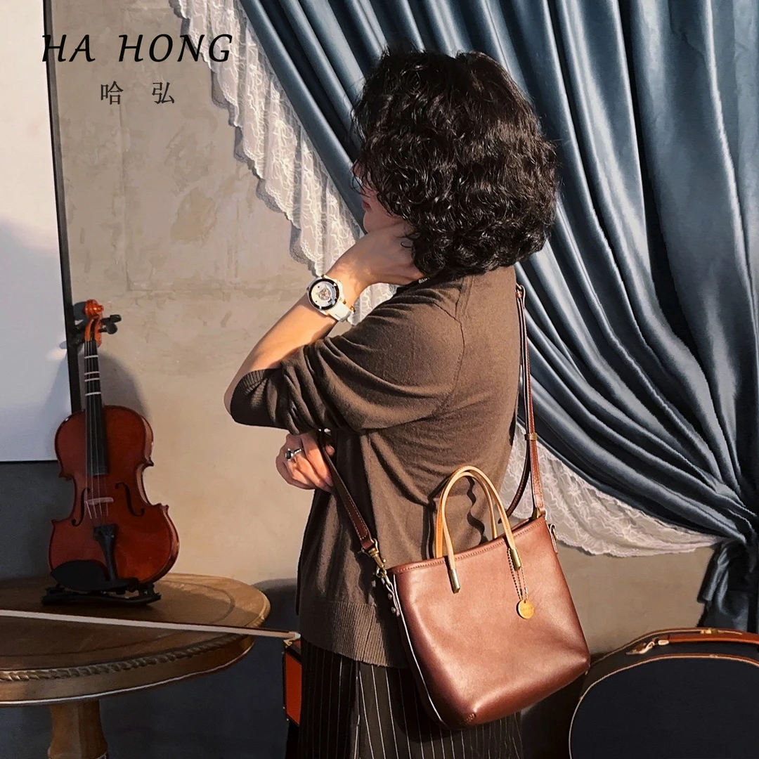 斯黛拉哈弘秋冬新款复古真皮定制头层牛皮雅丹水桶包纯色斜挎包