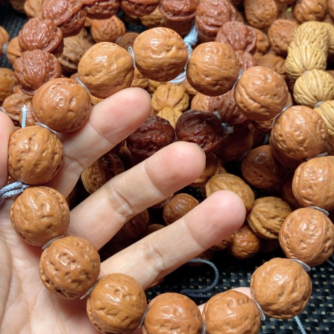 慕***蓉桃核手串粗筋足球