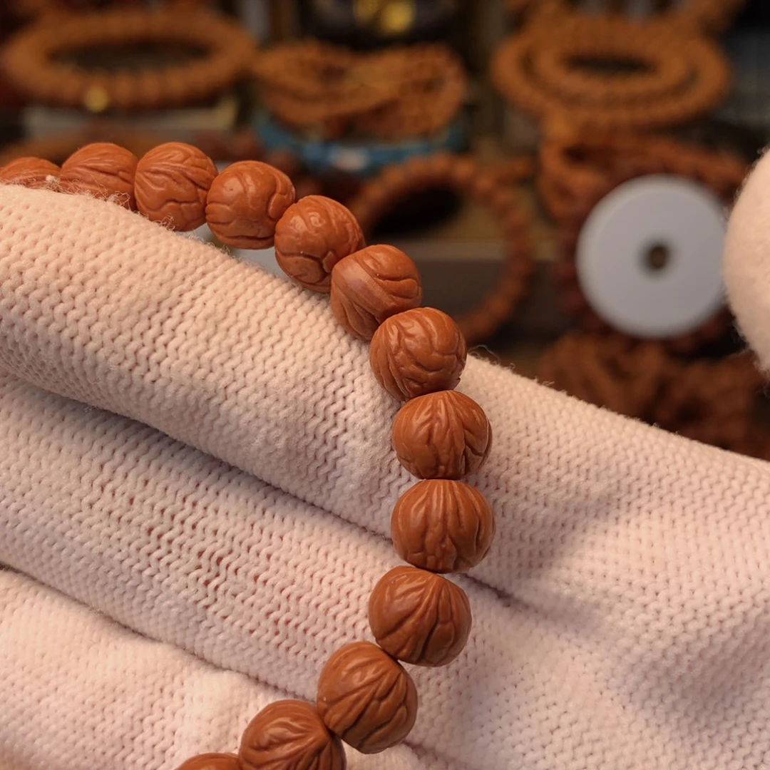 与***行手串桃核秦岭龙纹