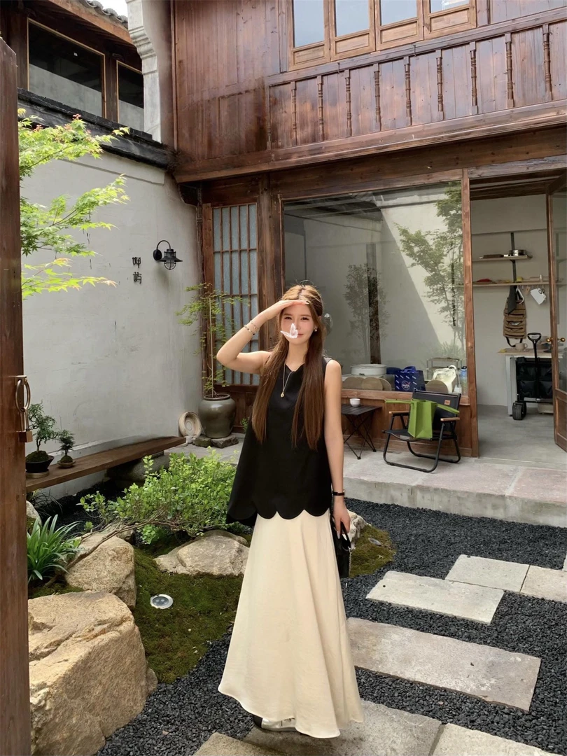 优秀的金蘑菇法式小众设计感波浪无袖背心+高腰A字垂感半身裙套装