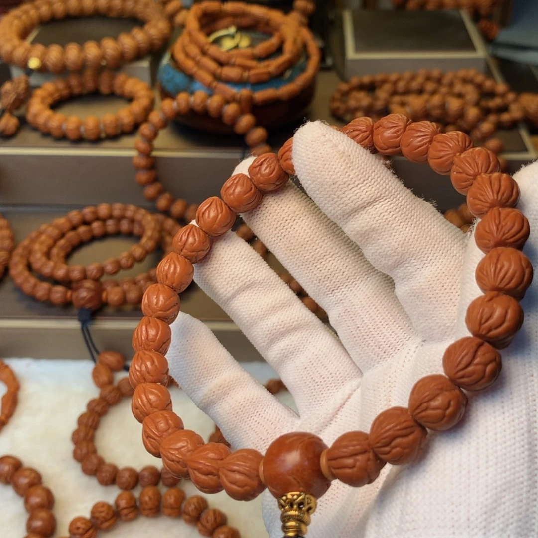 这***的手串桃核秦岭龙纹