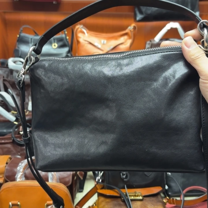 头层牛皮黑色水晶植鞣手提