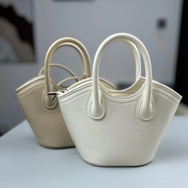 mini烧麦包女士水桶型小包包单肩包手提真皮拉链斜挎包小众时尚