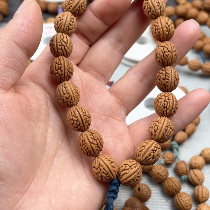 ?**之12.3尺寸野生桃核手持