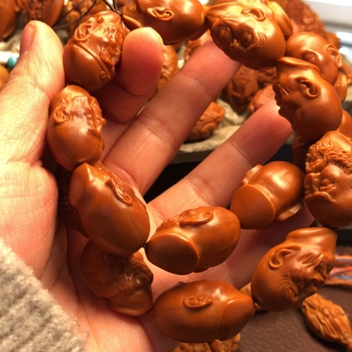 吃***饿吊坠橄榄核橄榄核雕刻的手持