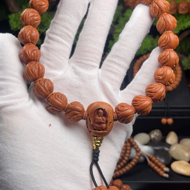 墨***涵桃核吊坠精品小凤羽