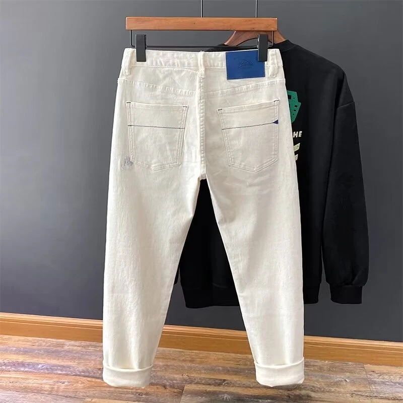 高端欧货白色男士潮流牛仔裤男款修身小脚刺绣弹力百搭青年长裤子