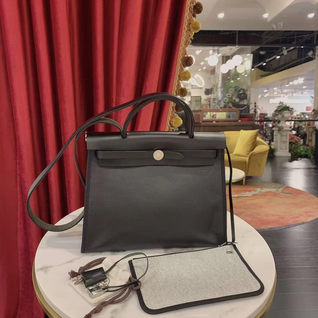 95新 Hermes/爱马仕 herbag31黑金防水布拼皮单肩包/77931053