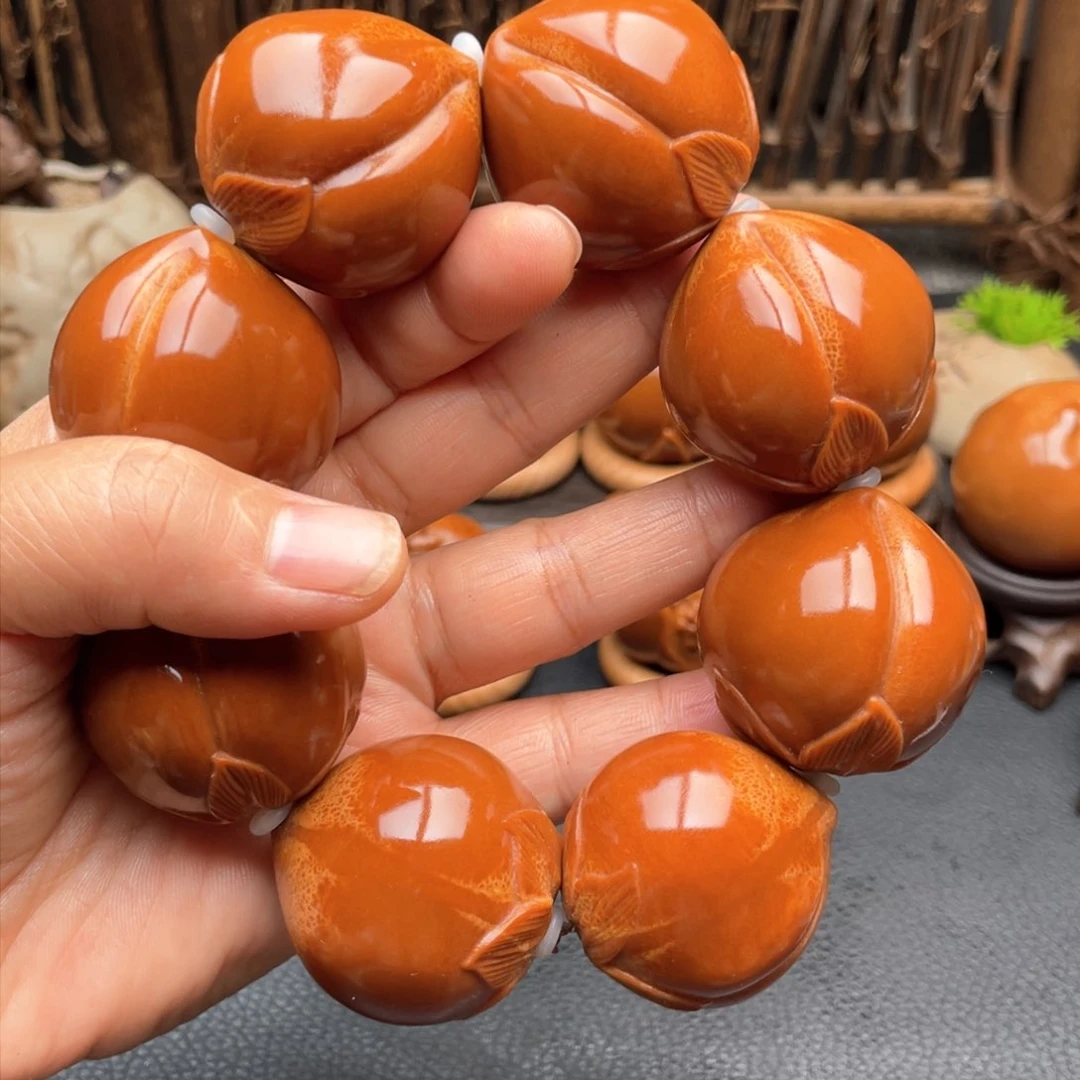 把件橄榄核寿桃手持