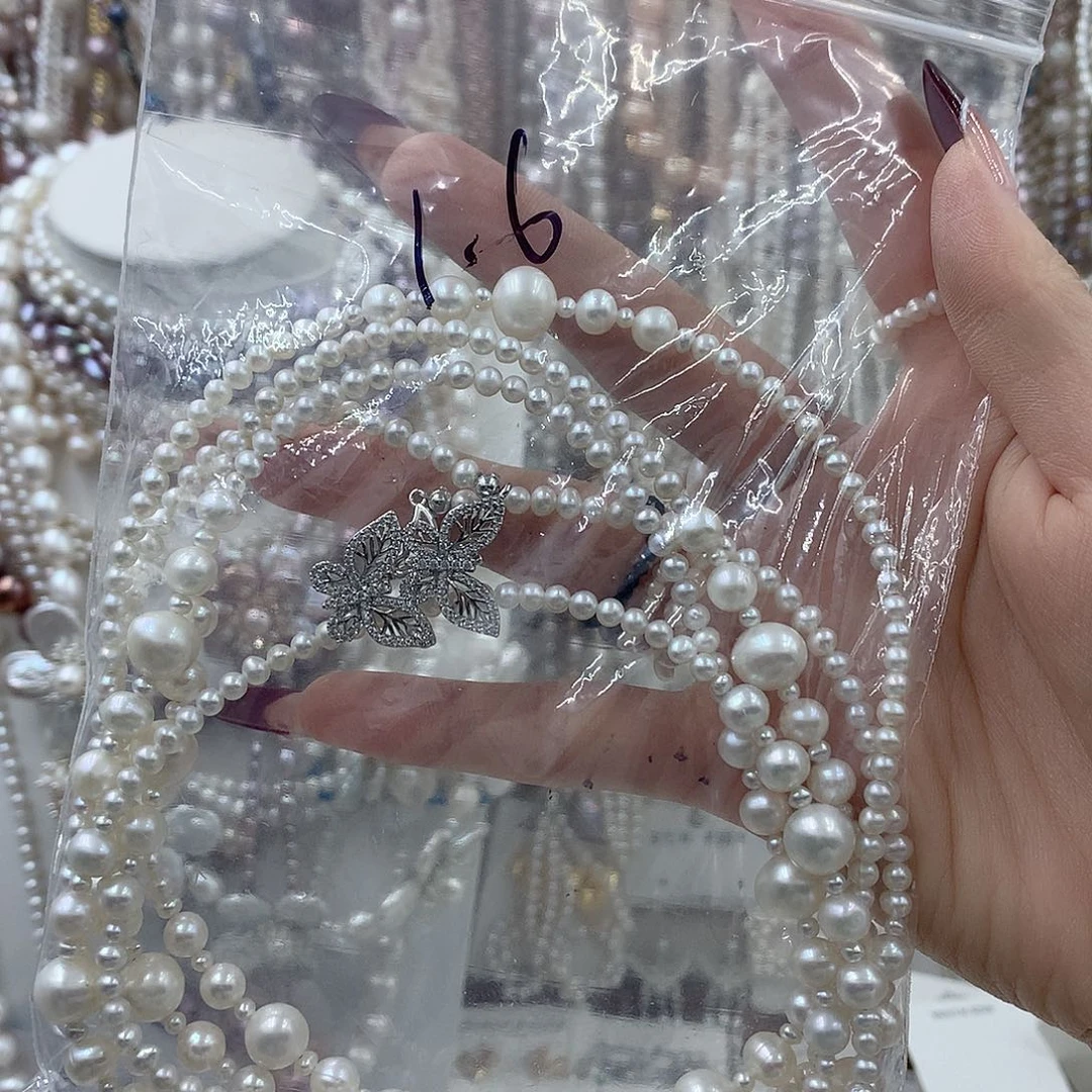 温***光淡水珍珠银S925镶嵌耳饰