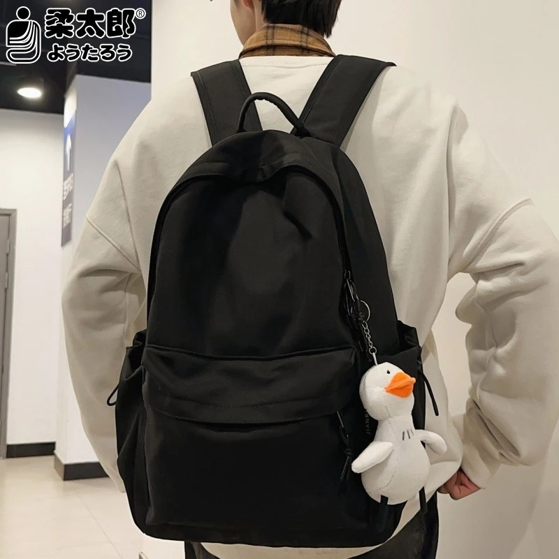 日本柔太郎黑色背包男士百搭简约纯色大容量双肩包高中生书包男大