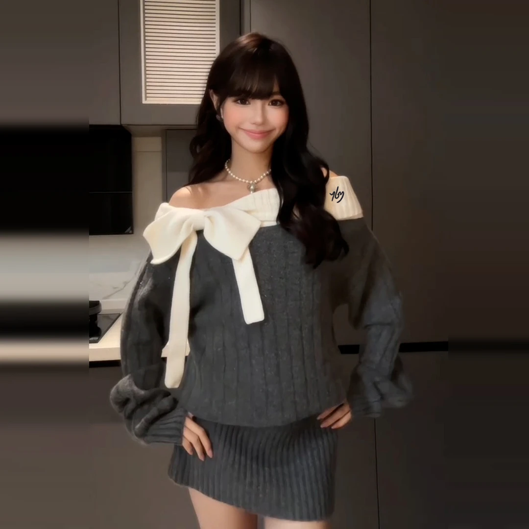 灰色一字肩长袖针织连衣裙子女秋冬2026新款修身显瘦露肩包臀短裙