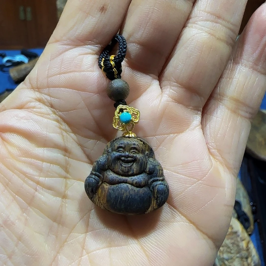 沉香碎屑沉香海南白奇乌身老料笑脸佛小精品