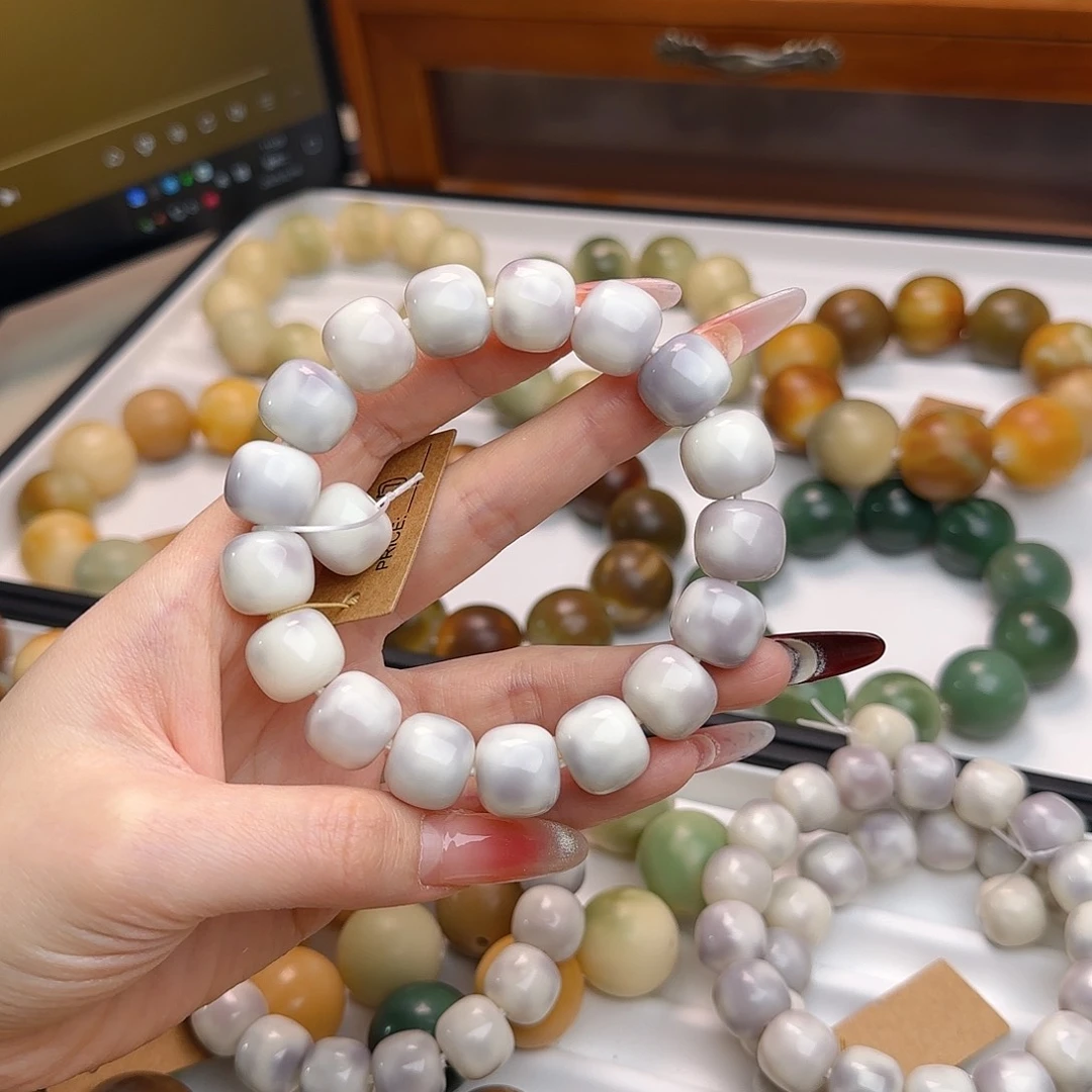 菩提根/象牙果手串?***?卡14.5紫色飘花