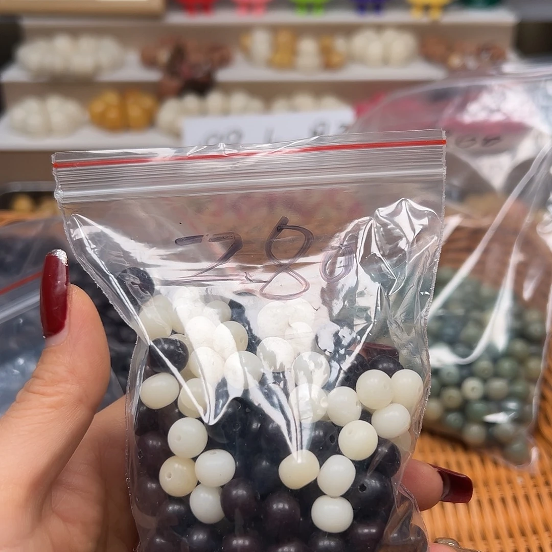 莲***风手串菩提根/象牙果瑕疵280颗左右