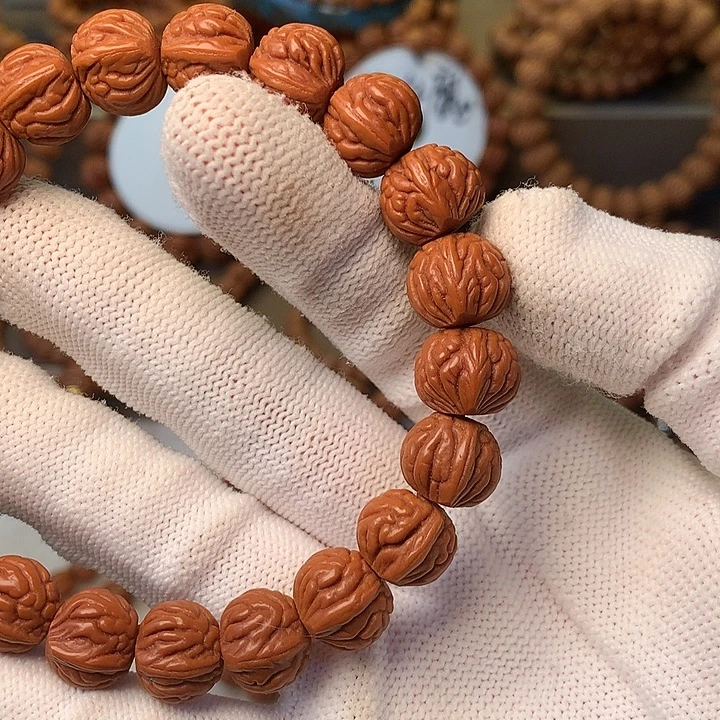 承***）手串桃核秦岭龙纹