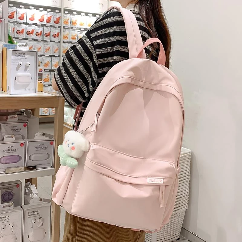 粉色书包女生小学生2025新款高中初中生女孩背包简约大学生双肩包