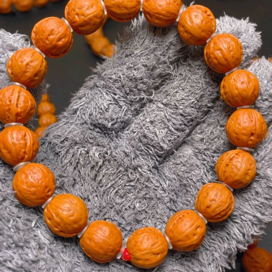 文玩核桃吊坠如***果野生文玩手串