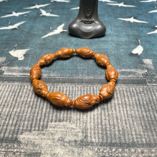 十小弥勒油核雕刻特价橄榄核手工雕