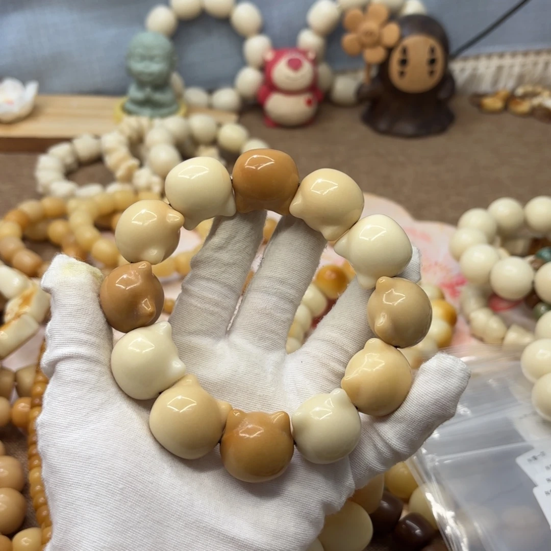 吊坠菩提根/象牙果23+机抛瑕疵牙果猫头578