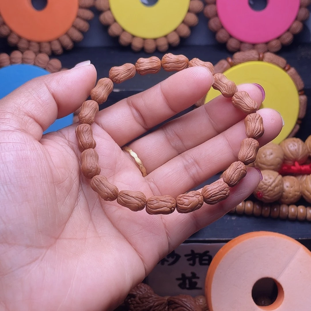 井***勇手串桃核秦岭龙纹桃核小棒骨