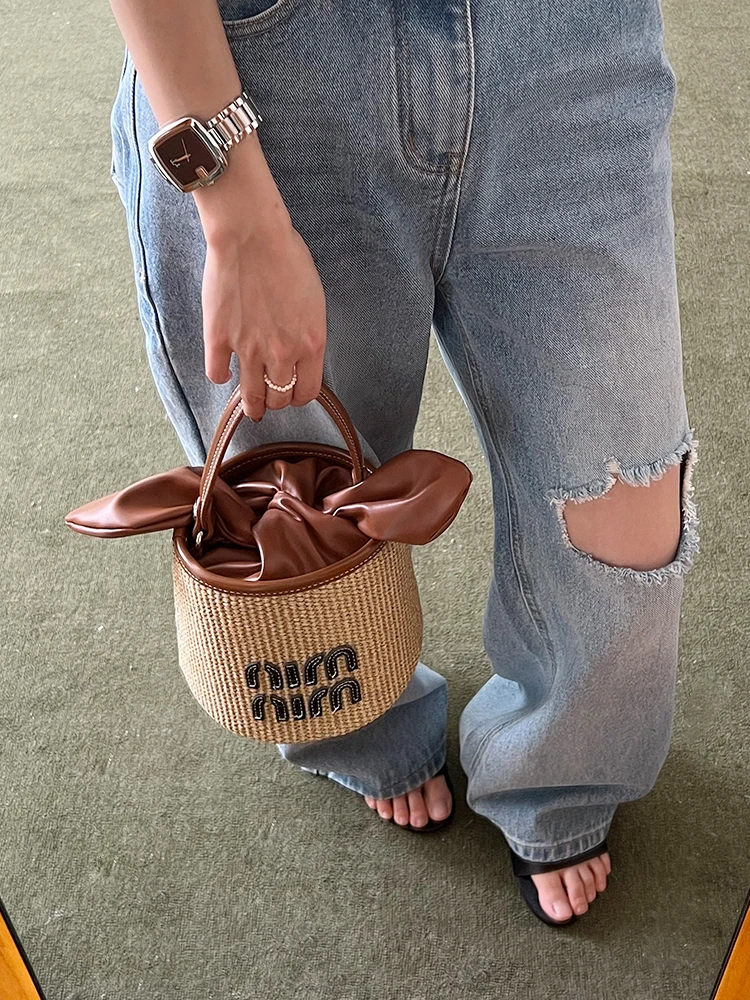 草编水桶包小号2025新款休闲度假风蝴蝶结手提包斜挎小包包编织包