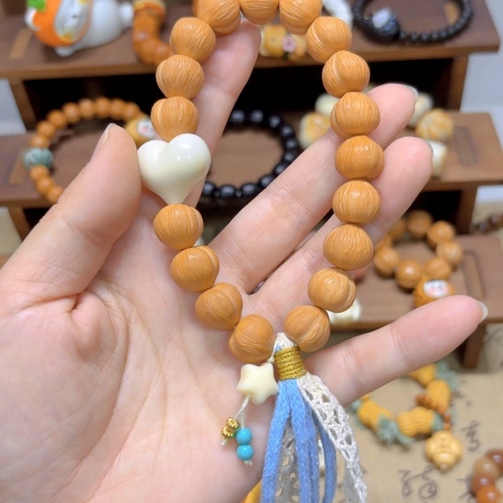 星月菩提手串猴头爱心13mm手持象牙果爱心不打结款