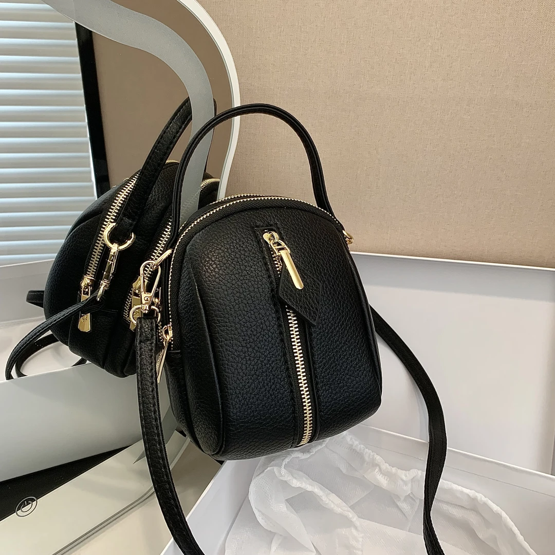 真皮贝壳包包女2025新款竖款手机包时尚女士斜挎包洋气百搭休闲包