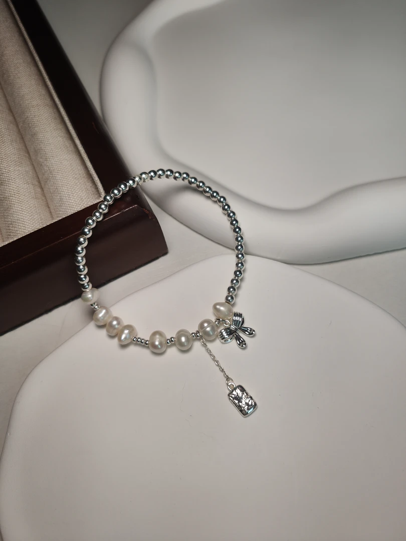 合金仿珍珠手链 珍珠蝴蝶结手链镭射圆珠弹力绳小众叠戴款