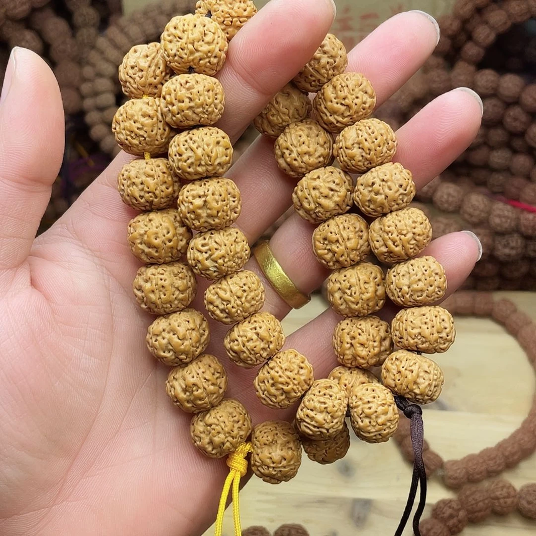 金刚菩提手串一****子果冻皮梅花双龙，姜黄皮