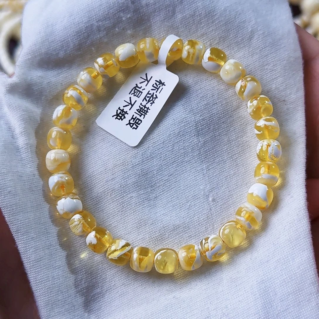 A***g琥珀未镶嵌裸石7mm金漆白溶洞妖花